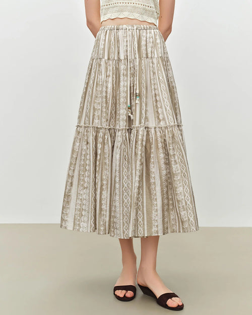 Women's apricot flowy A-line midi skirt, featuring a breathable viscose-lyocell blend and paisley print for effortless bohemian resort charm or beach mornings.