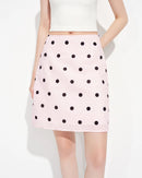This pink, high-waisted, polka-dot A-line mini-skirt is crafted from a breathable and comfortable linen-cotton blend fabric. It perfectly showcases a gently flared hemline and a delicate polka-dot print, creating an effortlessly relaxed yet feminine silhouette.