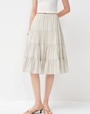 Shop LouNap's striped A-line midi skirt — ruffle hem, elastic waist, breathable viscose knit.