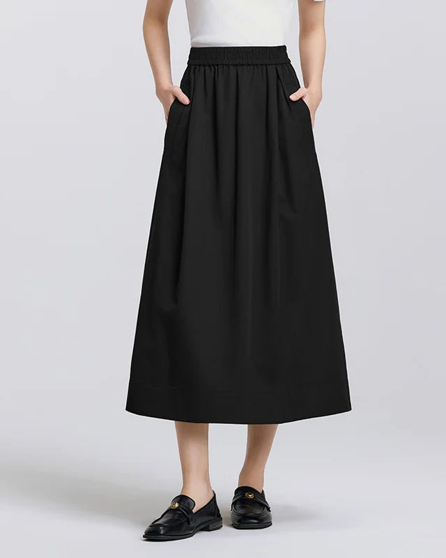 Loose A-line cotton Tencel skirt with elastic waist & side pockets. Breathable, flattering, versatile for commute, casual & weekend wear.

