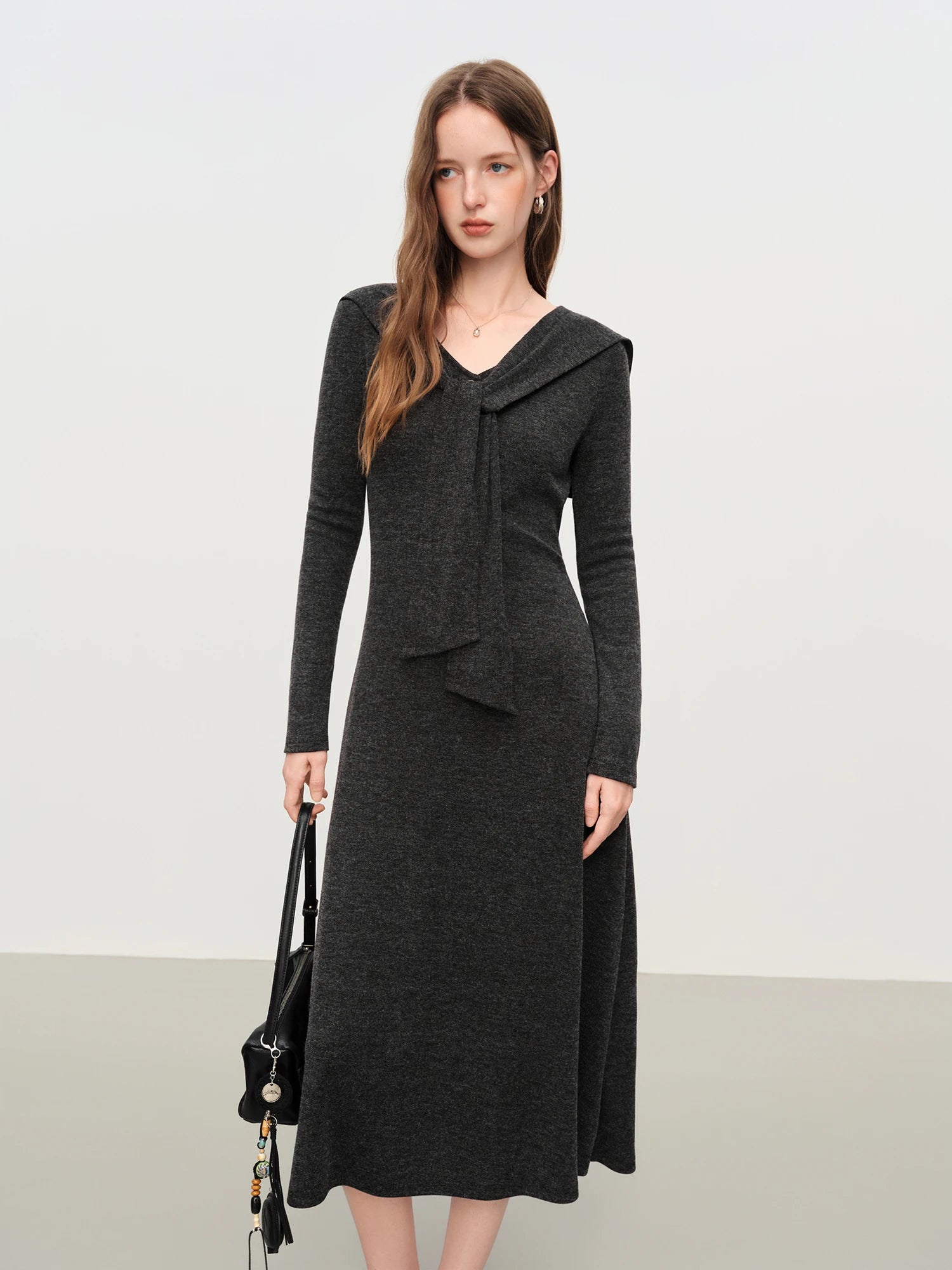 Women's scarf collar A-line knit dress with medium stretch, featuring soft polyester-viscose blend and French-inspired silhouette for autumn office wear or winter dining.
