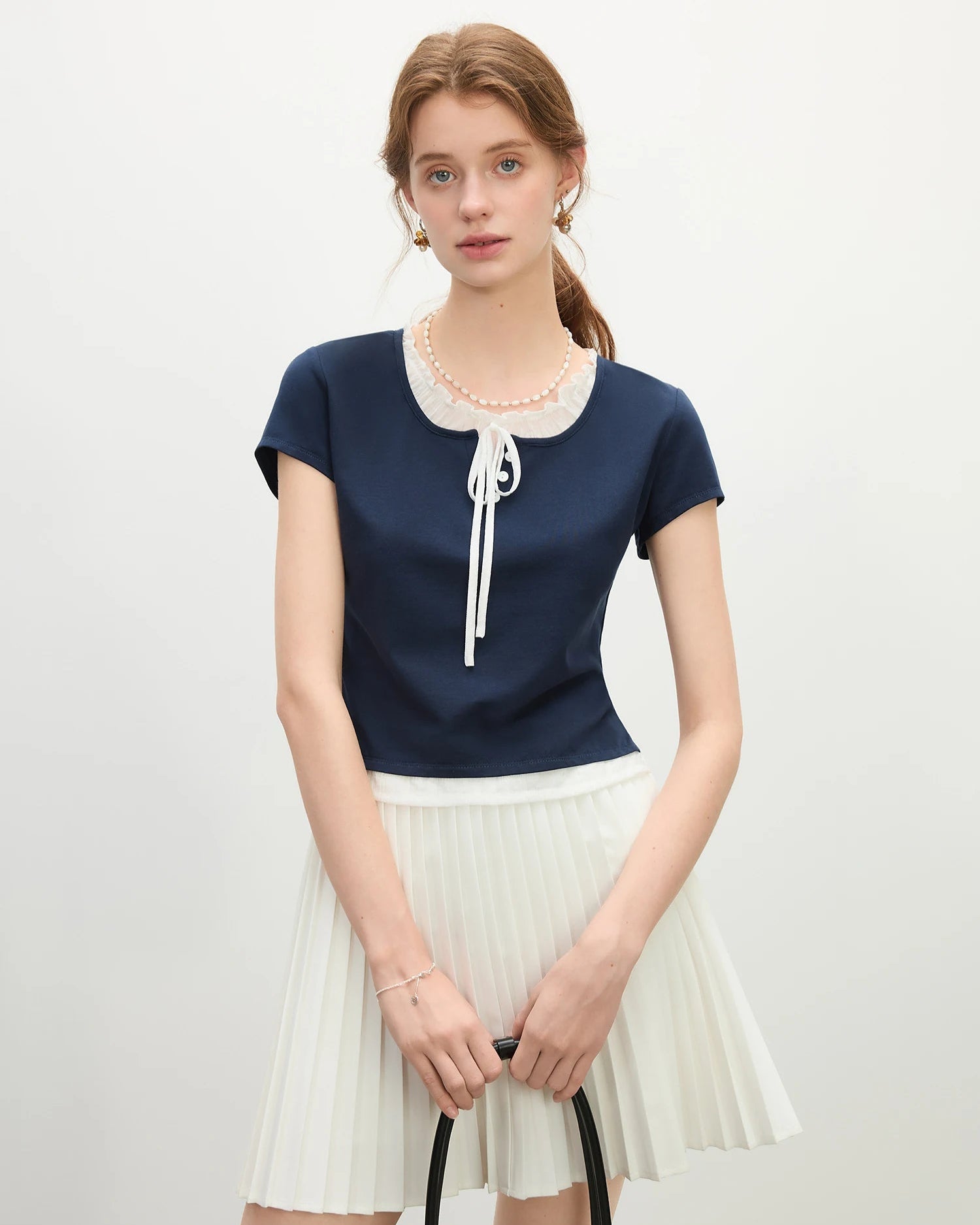 Sailor collar lace-up knit top — soft cotton-lyocell blend, slight stretch, classic nautical style for spring and summer. 

