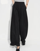 Loose-fit flared ankle pants in soft cotton-nylon-lyocell knit blend, featuring an elastic waistband and wide-leg cut — women's versatile casual trousers.