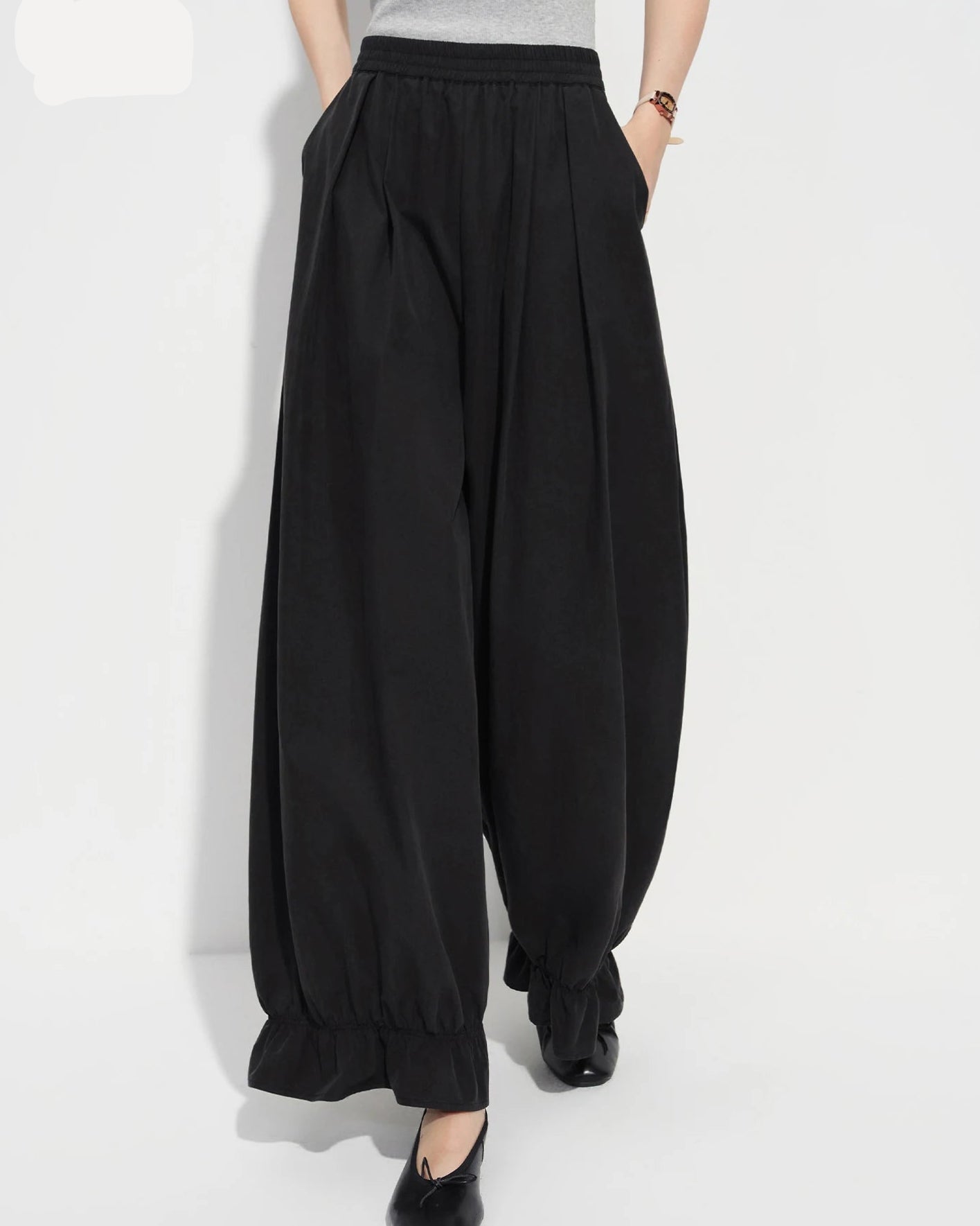 Loose-fit flared ankle pants in soft cotton-nylon-lyocell knit blend, featuring an elastic waistband and wide-leg cut — women's versatile casual trousers.