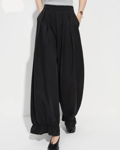 Loose-fit flared ankle pants in soft cotton-nylon-lyocell knit blend, featuring an elastic waistband and wide-leg cut — women's versatile casual trousers.