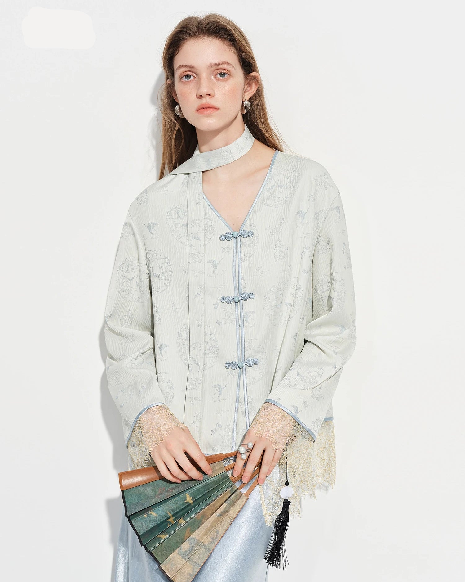  Elegant women's V-neck lace-trimmed blouse with a relaxed silhouette, versatile spring top for everyday polished dressing.