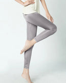 The ankle-length hem and mid-rise waist create a clean, elongating line, while the silk-touch fabric keeps the skin cool and smooth throughout the day.