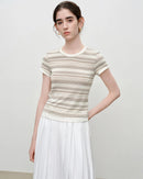 A round neckline and short sleeves keep the look polished yet relaxed — ideal for office mornings or weekend outings.