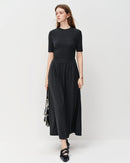 Elegant dark grey pleated A-line maxi skirt made from a soft viscose cotton blend, featuring delicate embroidery and a loose fit, perfect for office wear or casual autumn outfits.