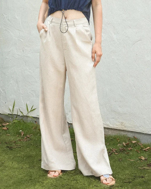 High-waisted wide leg straight pants featuring a flowy, floor-length silhouette. This loose-fit trouser style offers a comfortable drape and elongating look, perfect for casual or office wear.