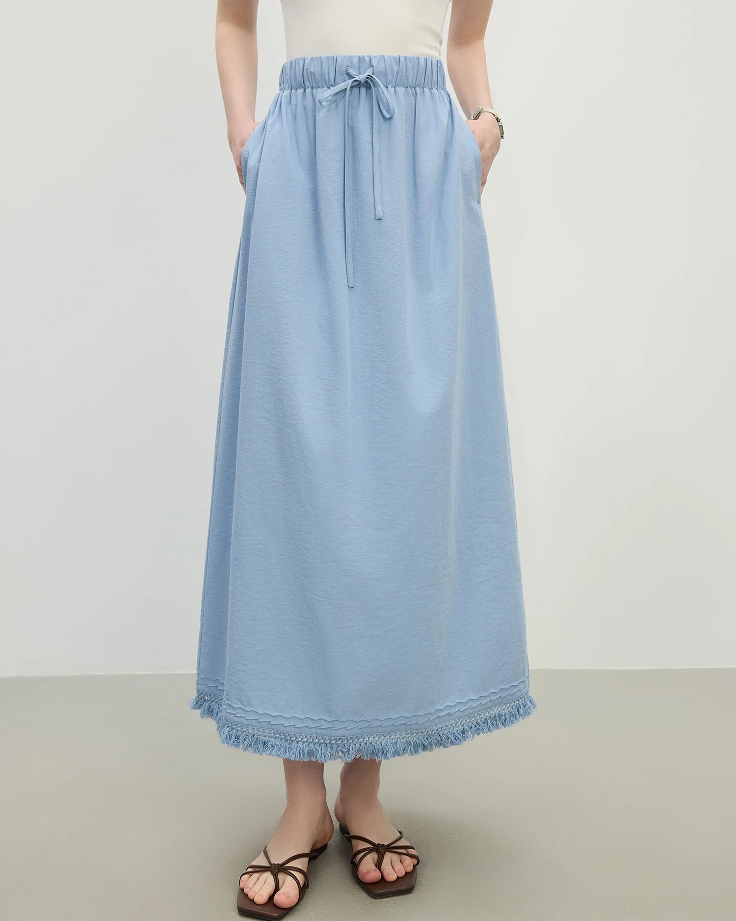 Premium loose fit solid color A-line knit skirt crafted for ultimate comfort, offering a flowy silhouette and soft texture ideal for your lounging needs or daily activities.