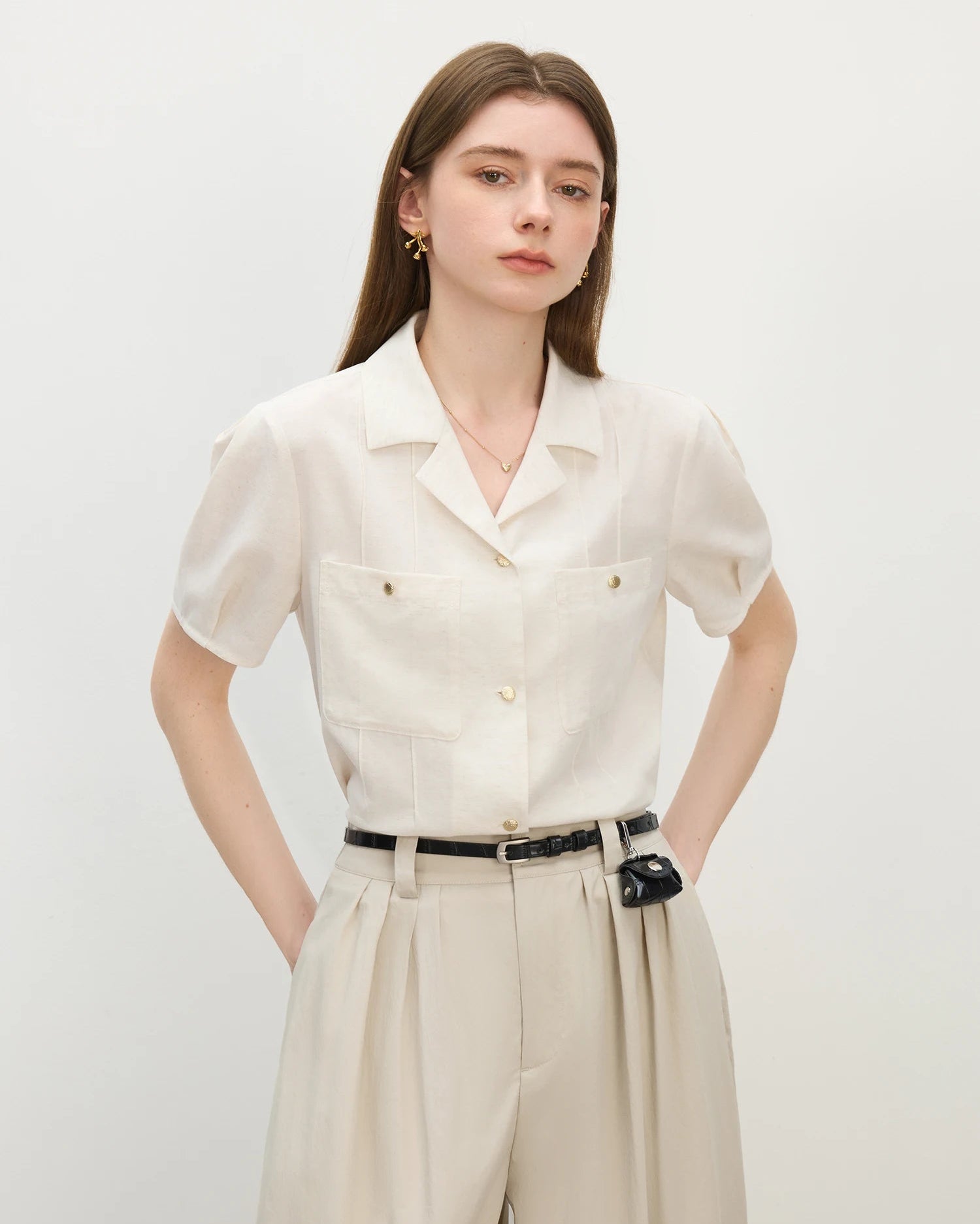 Women's breathable lyocell-linen blend shirt with polo-neck collar & short sleeves. Soft knit drape, relaxed fit — effortlessly cool for summer days.