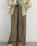 High-waist wide-leg trousers in viscose-nylon blend with elastic waist & pleated front. Lightweight, flowing drape for effortless spring-summer style.