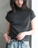 Slim-fit half-high collar knit top in breathable stretch fabric. Elongated silhouette layers effortlessly for city commutes or resort evenings.