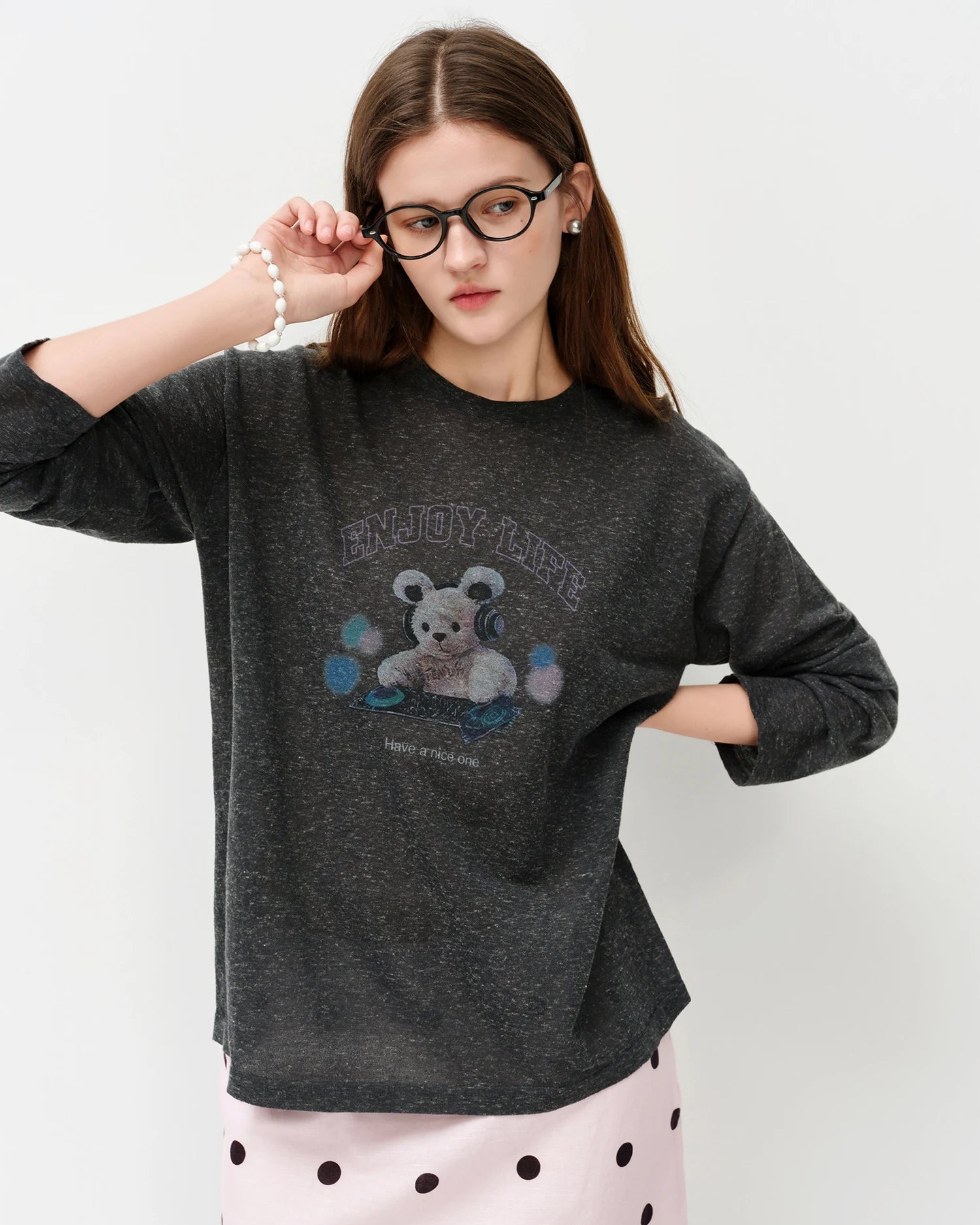 Premium dark grey lightweight sheer knitted shirt crafted from a soft linen-gauze blend, offering a breezy drape and structured transparency for a sophisticated summer fashion statement.