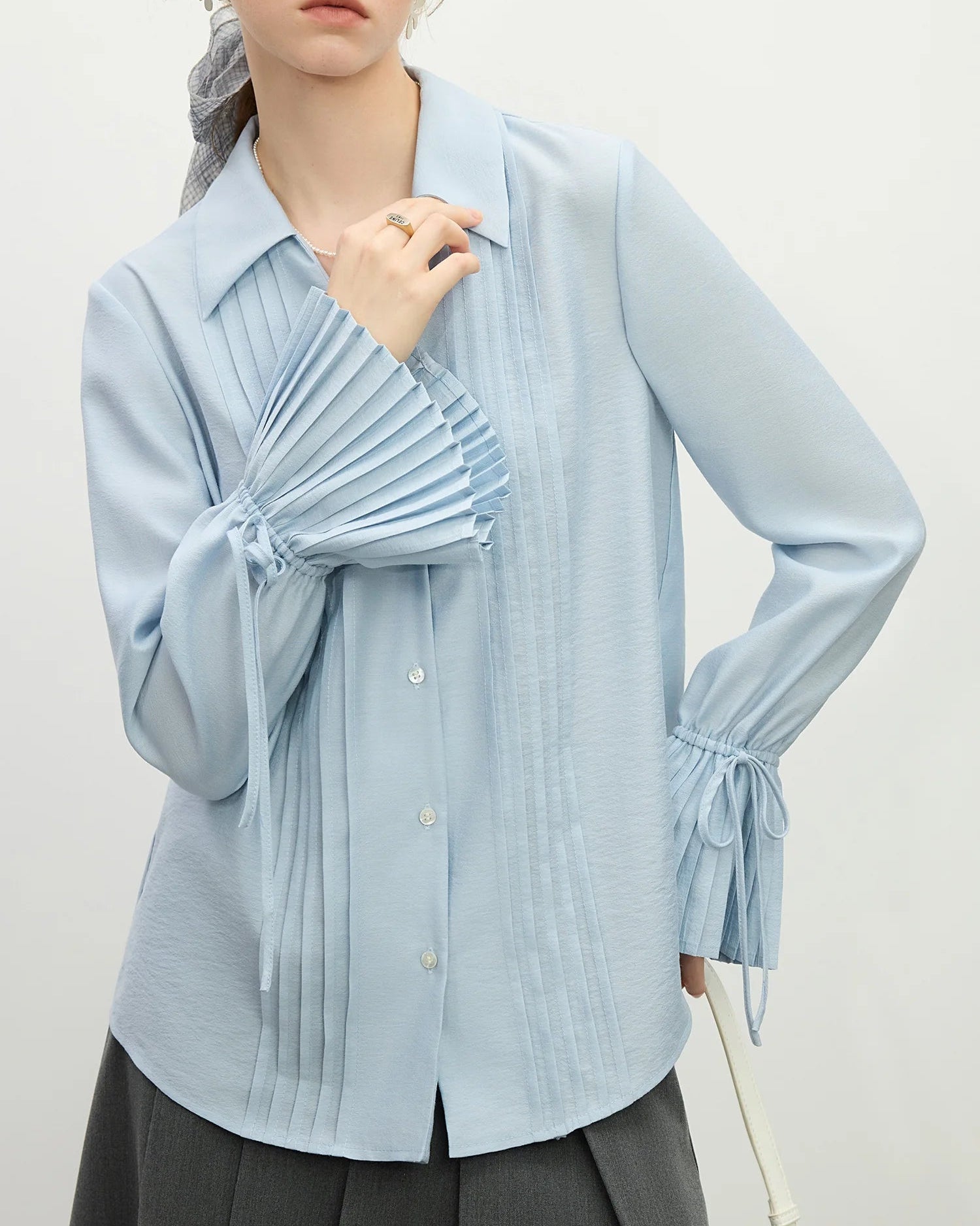 Pleated sleeve woven blouse — crafted from lyocell, acetate, and linen for a breathable, fluid drape. Relaxed fit, effortless style for spring and summer.