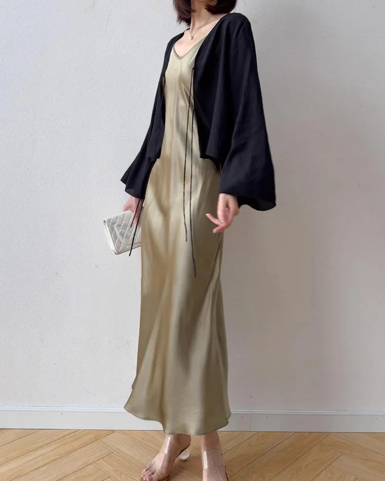 100% mulberry silk spaghetti strap V-neck fit-and-flare maxi dress. Fitted waist, flowing A-line skirt in 6 solid colours for spring & summer.