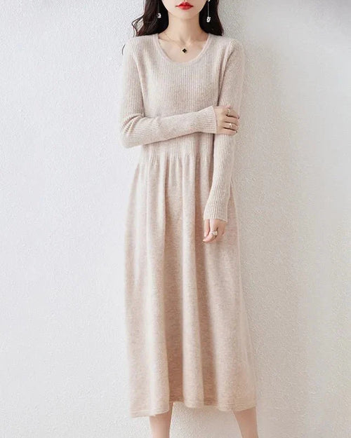 A-line knit dress with a round neck and full sleeves. High-stretch, mid-calf length, naturally warm.