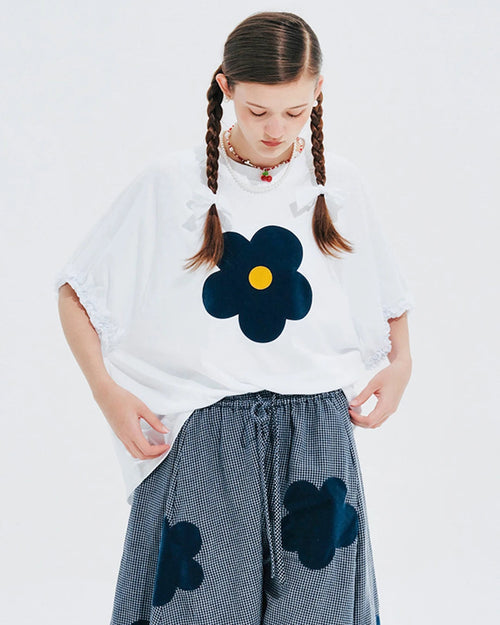 Our Floral Appliqué Knit Tee — a breathable, relaxed-fit summer top crafted from soft blended fabric. Delicate floral detail, slight stretch. 
