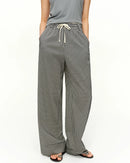 High-waist plaid straight-leg trousers in lyocell-acetate blend with slight stretch. Polished, office-ready drape for effortless spring-summer style.
