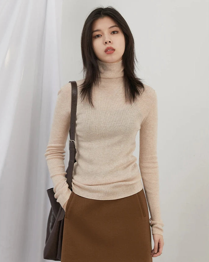 Women's slim-fit turtleneck knit sweater. High-stretch, lightweight blend in black, apricot & coffee. Polished office-ready warmth for fall & winter.