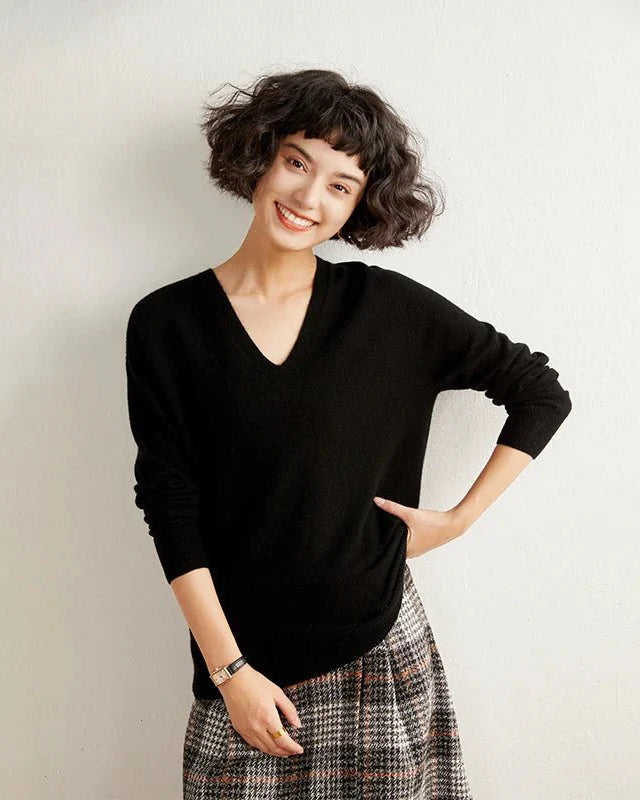 Woman brunching in a V-Neck Cashmere Pullover Sweater,  Mongolian cashmere drapes like silk—your luxe yet breathable 60-75 °F spring-fall layer.